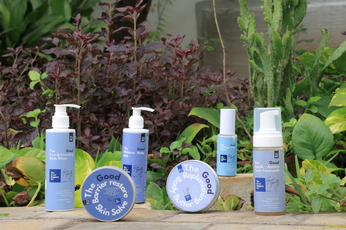 Skincare products displayed outdoors with lush greenery