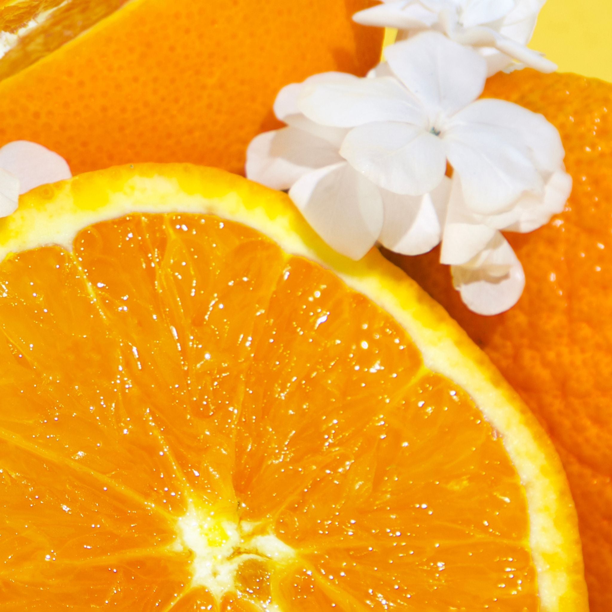 Bright Spot car freshener with Italian summer room spray scent featuring fresh orange and white flowers